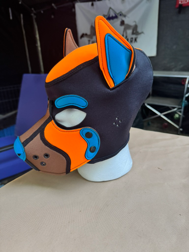 Mr. S Leather custom pup hood (orange, blue and tan) — 2026 Pup Games prize